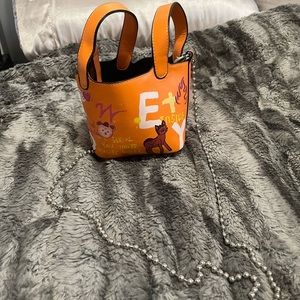 Mini graphic crossbody bag